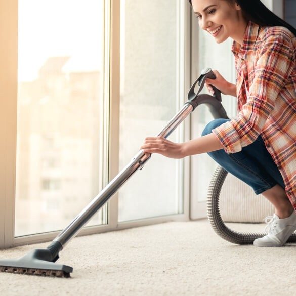 vacuuming carpet | Sarmazian Brothers Flooring