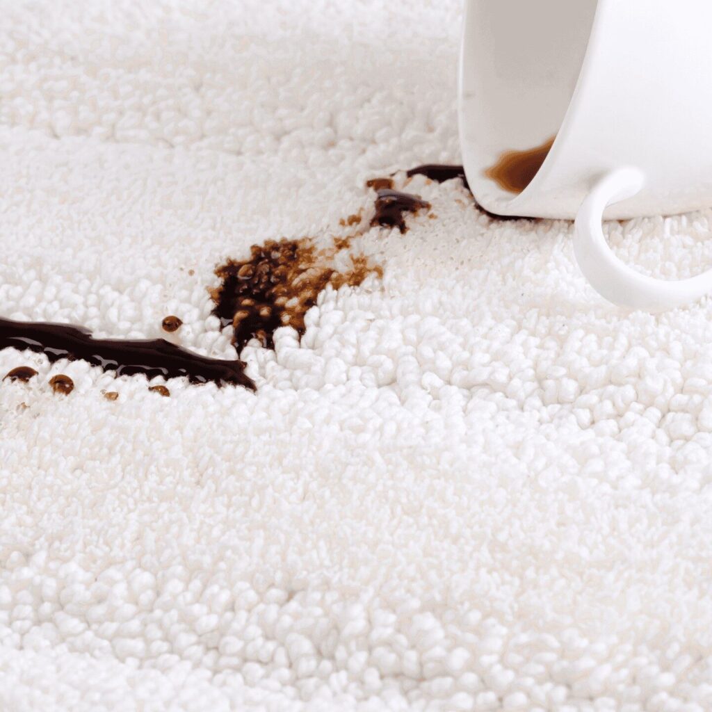 Coffee spilled on white carpet
